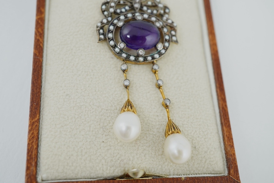 An Edwardian style yellow metal, cabochon amethyst, seed pearl, diamond and cultured pearl double drop pendant, on a 375 chain, pendant 54mm, gross weight 7.5 grams. Condition - fair